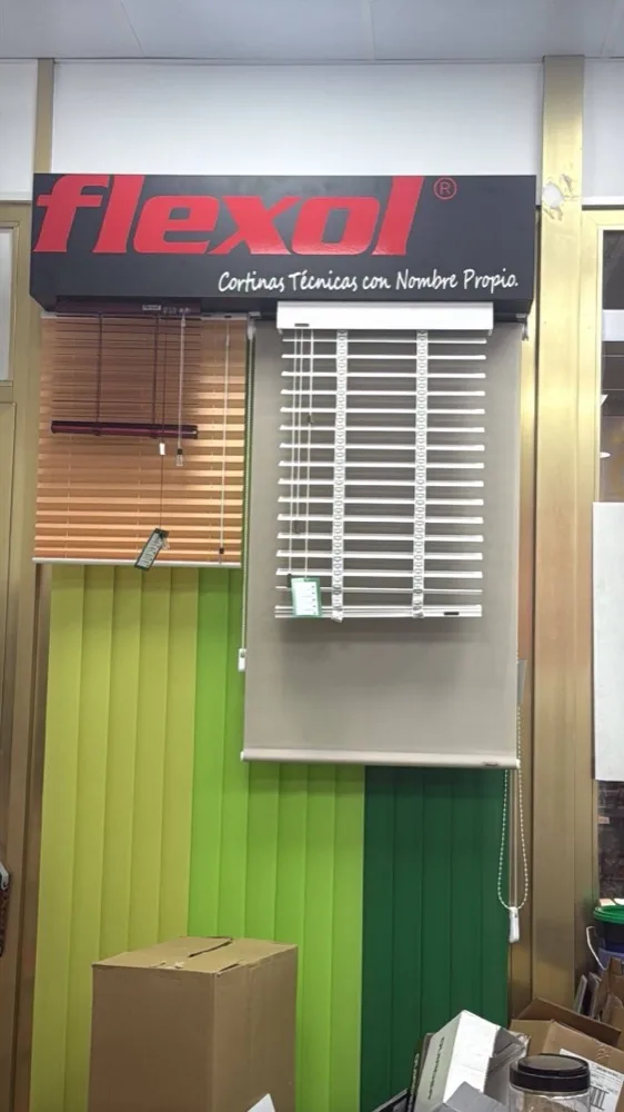 The Flexol display in the shop, with a white venetian blind hung under the sign.